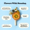 Dried flower buttonhole with a orange strawflower and white and blue accents wrapped with a white ribbon against a soft blue background