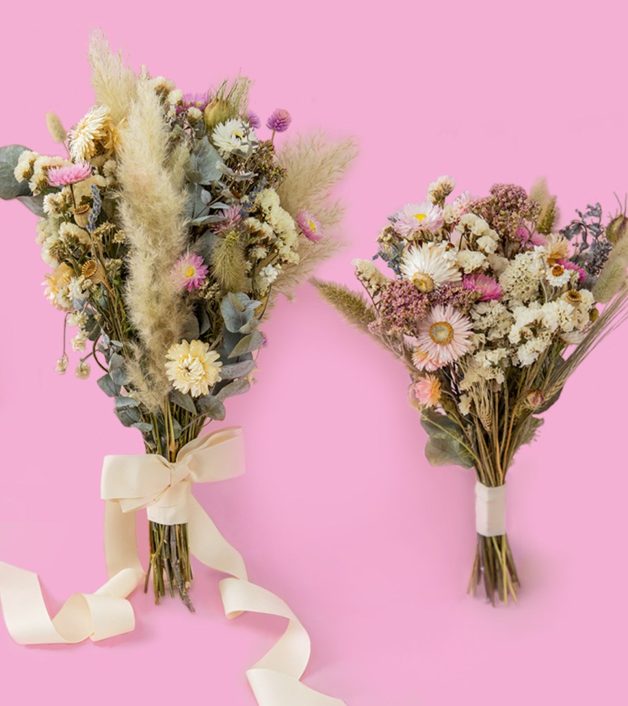 Wedding Banner Mobile Dried Wedding Bouquets. Bridal and matching bridesmaid bouquets with preserved white, ivory and neutral dried flowers and soft light-pink accents, tied with a gorgeous ivory ribbon